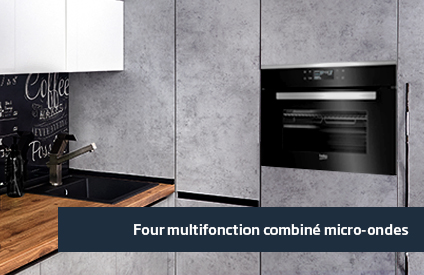 Four combiné micro-ondes encastré dans une cuisine industrielle 